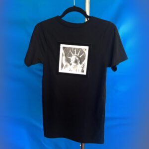 Liberty print shirt hanging on hanger