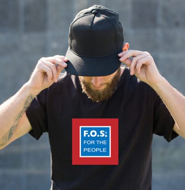 Man adjusting black cap, looking down