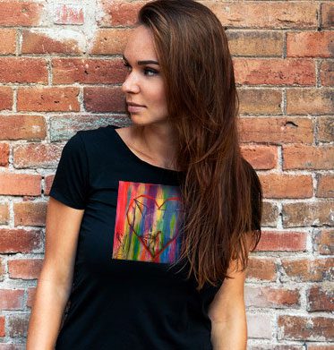 Woman posing against brick wall