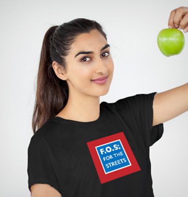 Smiling woman with ponytail and apple